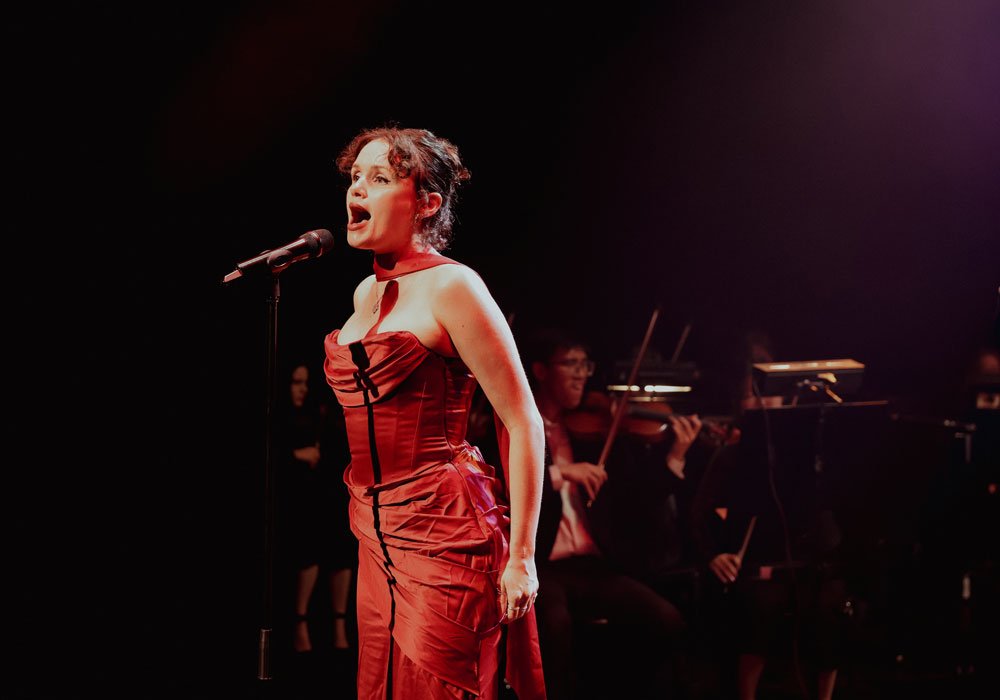 Close-up of a Theatrical Symphony musician singing during a live show
